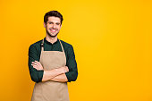 Photo of white cheerful positive man smiling toothily with arms crossed expressing positive emotions on face near empty space isolated bright color background