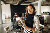 Photo of young business woman in the office