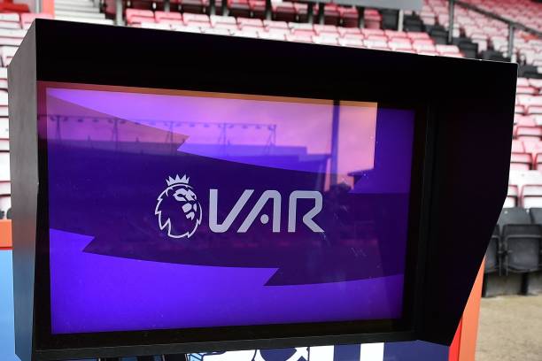 Picture shows the VAR monitor beside the pitch.
