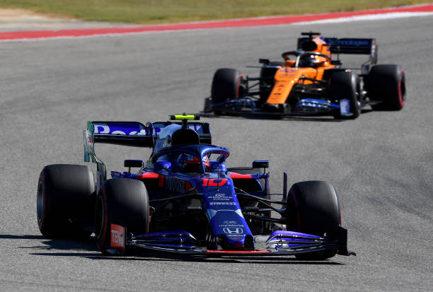 Pierre Gasly of France driving the Scuderia Toro Rosso STR14 Honda leads Carlos Sainz of Spain driving the McLaren F1 Team MCL34 Renault on track...