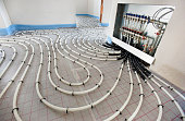 pipes of under floor heating in construction of new residential house