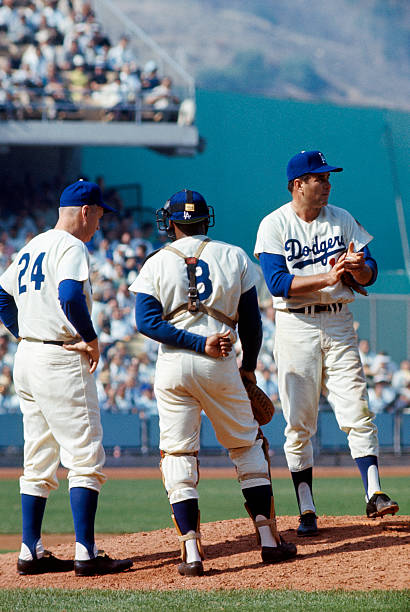 pitcher-ron-perranoski-looks-toward-the-bullpen-as-walter-alston-and-picture-id51678915