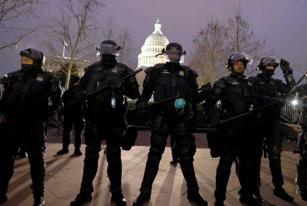 Police officers in riot gear line up as protesters gather on the U.S. Capitol Building on January 06, 2021 in Washington, DC. Pro-Trump protesters...