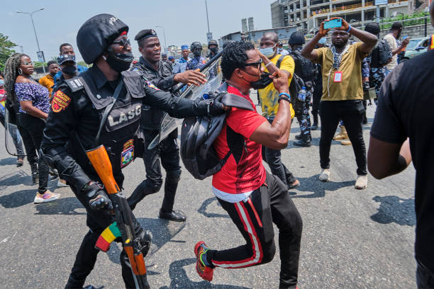 Policeman arresting a protestor during a demonstration against the re-opening of the Lekki toll plaza in Lagos. Activists had called for a renewed...