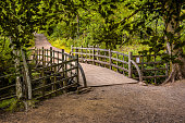 Pooh Bridge located in the One Hundred Acre woods in the stories by AA Milne of Christopher Robin and Winnie the Pooh .