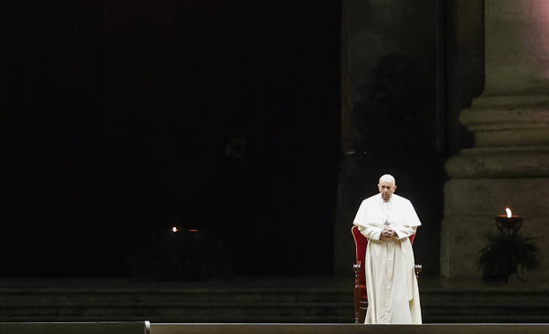 Pope Francis presides the Via Crucis torchlight procession in a St. Peter's Square with a small presence of faithful, at the Vatican, April 02, 2021....