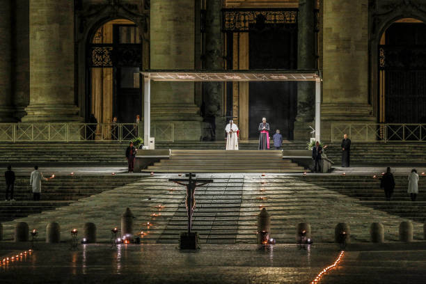 Pope Francis presides the Via Crucis torchlight procession to commemorate the crucifixion of Jesus Christ, in St. Peter's Square at the Vatican on...