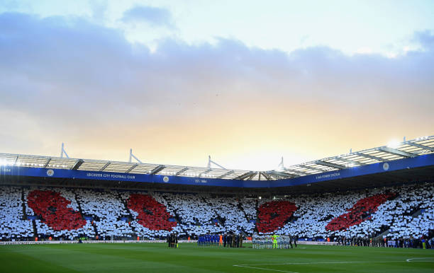 Poppy design is displayed in the crowd as players and officials line up for a minute's silence ahead of Remembrance Sunday prior to the Premier...