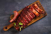 Pork loin ribs served on chopping board