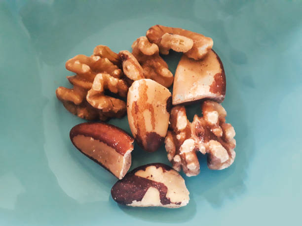 portion of brazil nuts and walnuts for a healthy meal picture id1272515882?k=20&m=1272515882&s=612x612&w=0&h=cLwHHPvzyoSGh6qHNoOxOG 4DpkysosylKywLatek80=