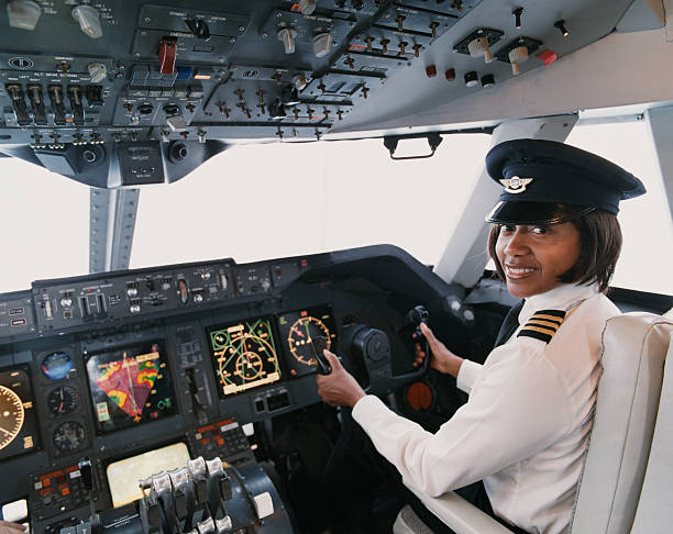 portrait of a female pilot sitting in the cockpit picture