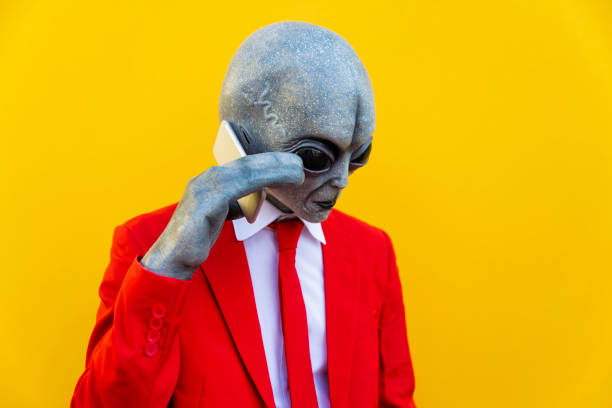 portrait of man wearing alien costume and bright red suit using smart picture id1322221598?k=20&m=1322221598&s=612x612&w=0&h=ei b2Xmq4tNGYJTUmH64tD7Vg8UD4GgL hPBMog REg=