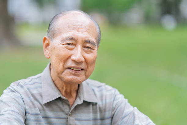 portrait of senior adult man outdoors - asian old man smiling stock pictures, royalty-free photos & images
