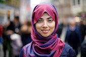 Portrait of smiling muslim woman outdoors
