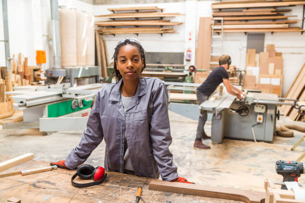portrait of young black female worker in a furniture factory picture