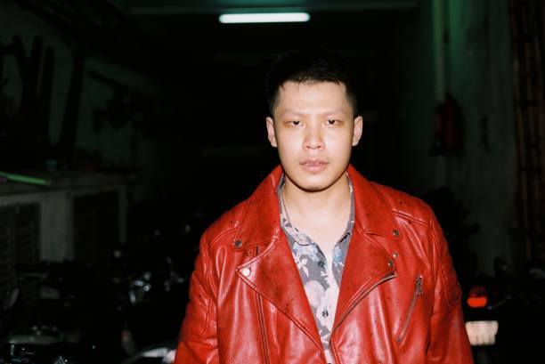 Portrait of young man standing in darkroom,Vietnam