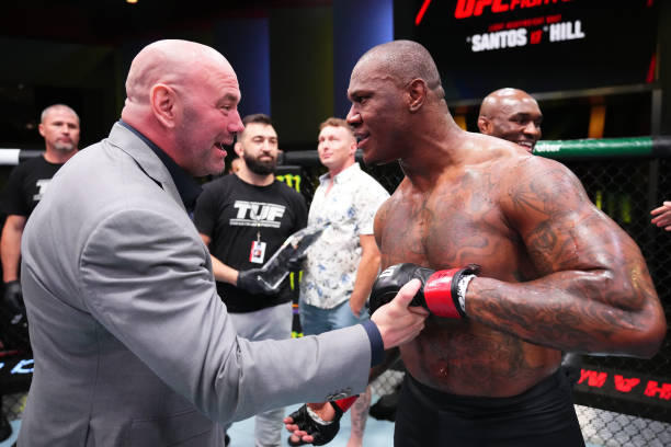 President Dana White awards a UFC contract to Mohammed Usman of Nigeria after his victory over \zp in a heavyweight fight during the UFC Fight Night...