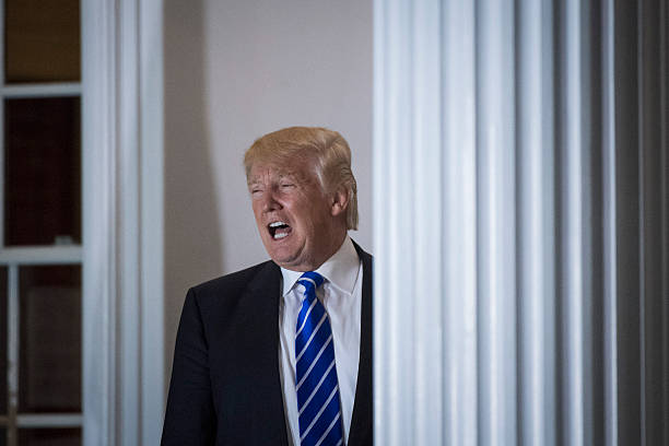 President-elect Donald Trump shouts out to members of the media at the clubhouse at Trump National Golf Club Bedminster in Bedminster Township, N.J....