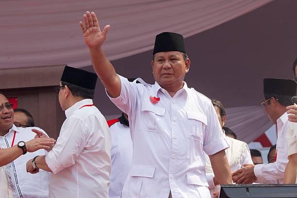 Presidential candidate retired general Prabowo Subianto the leader of the Gerindra party waves to supporters during an election rally at Gelora Bung...
