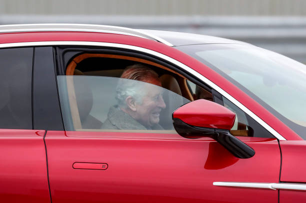 Prince Charles Prince of Wales drives Aston Martin's first SUV the Aston Martin DBX during his visit to the new Aston Martin Lagonda factory on...