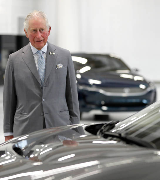Prince Charles Prince of Wales looks at future vehicles as he is shown the engineering hall during a visit to officially open the National Automotive...