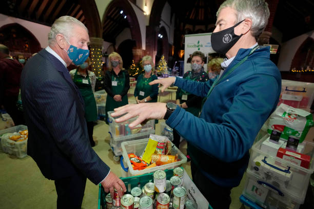GBR: The Prince Of Wales & Duchess Of Cornwall Visit A Trussell Trust Foodbank