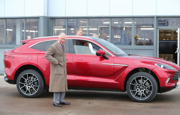 Prince Charles Prince of Wales with Aston Martin's first SUV the Aston Martin DBX during his visit to the new Aston Martin Lagonda factory on...
