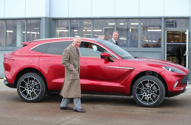 Prince Charles Prince of Wales with Aston Martin's first SUV the Aston Martin DBX during his visit to the new Aston Martin Lagonda factory on...