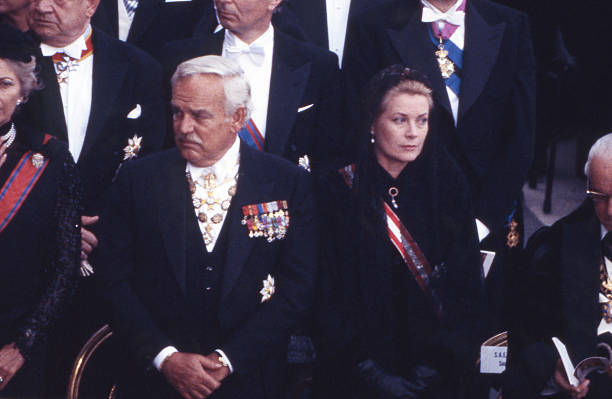 prince-rainier-iii-and-princess-grace-of-monaco-attend-the-funeral-picture-id526520436
