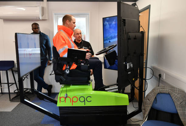 Prince William Duke of Cambridge operates an excavator simulator during a visit to the Tarmac National Skills and Safety Park on February 26 2020 in...