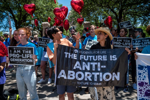 Pro-life protesters stand near the gate of the Texas state capitol at a protest outside the Texas state capitol on May 29, 2021 in Austin, Texas....