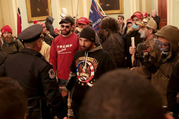 Protesters interact with Capitol Police inside the U.S. Capitol Building on January 06, 2021 in Washington, DC. Congress held a joint session today...
