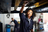 proud female garage mechanic .