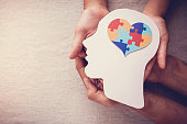 puzzle jigsaw heart on brain,  mental health concept, world autism awareness day