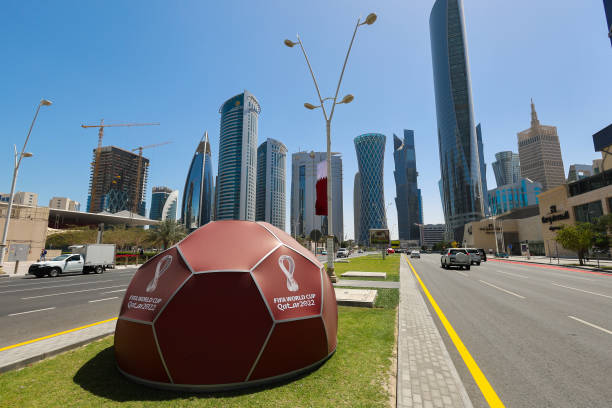 Qatar World Cup signage is seen on a giant football in the middle of the road in West Bay area of Doha on March 30, 2022 in Doha, Qatar.