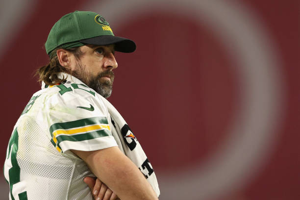 Quarterback Aaron Rodgers of the Green Bay Packers watches from the sidelines during the second half of the NFL game at State Farm Stadium on October...