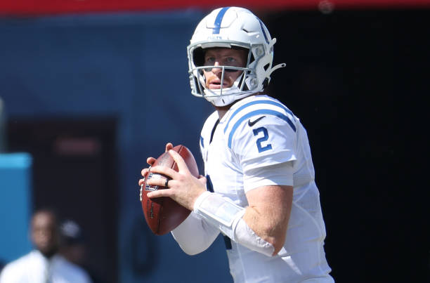 Quarterback Carson Wentz of the Indianapolis Colts looks to pass the ball in the first half of the game against the Tennessee Titans at Nissan...