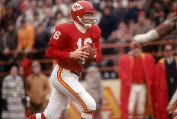 Quarterback Len Dawson of the Kansas City Chiefs drops back to pass against the New York Jets during an NFL football game circa 1968 at Municipal...