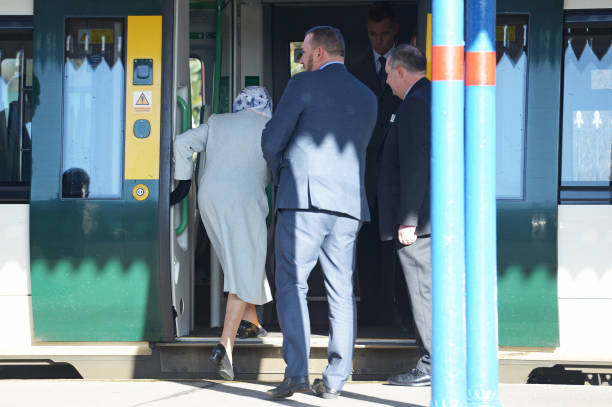 Queen Elizabeth II boards a train at King's Lynn railway station in Norfolk as she returns to London after spending the Christmas period at...