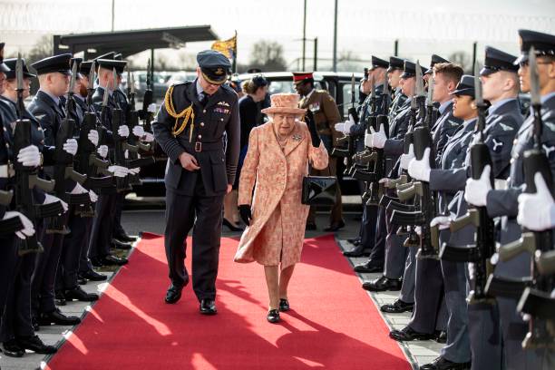 Queen Elizabeth II is escorted by Station commander Group captain James Beck past an RAF guard of honour as she arrives at RAF Marham to inspect the...