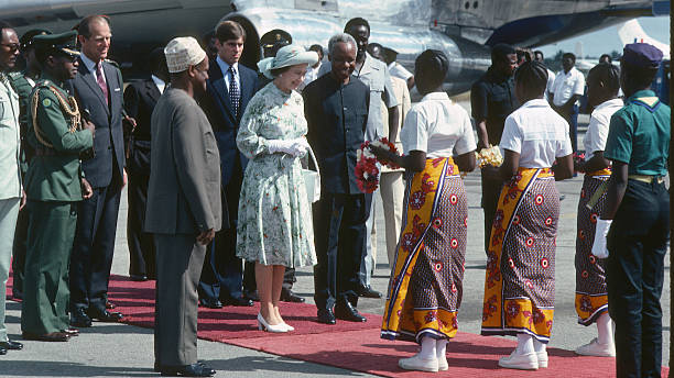 Queen Elizabeth ll Prince Philip Duke of Edinburgh and Prince Andrew are greeted by President Kenneth Kaunda as they arrive for a State Visit to...