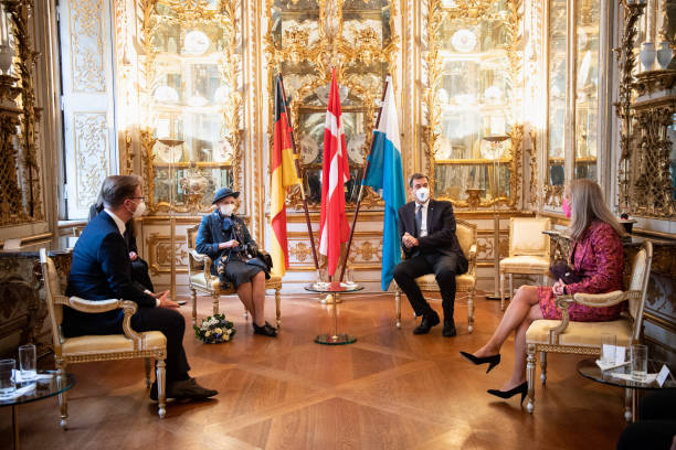 Queen Margrethe II of Denmark in conversation with Markus Söder , party chairman and Prime Minister of Bavaria and wife Karin Baumüller-Söder at the...