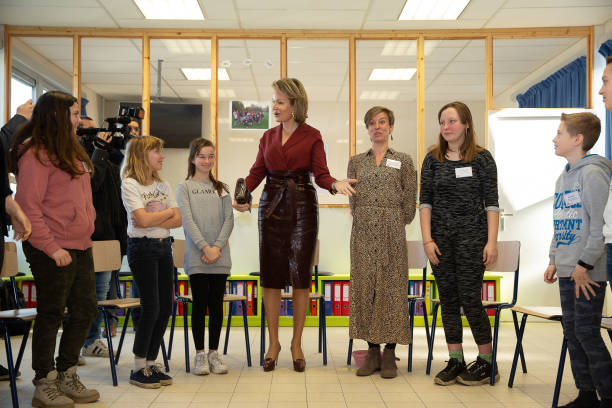 Queen Mathilde of Belgium and teacher Marieke Van de Walle are pictured during a visit to the GO Tuinbouwschool in Melle on February 19 2020 during a...