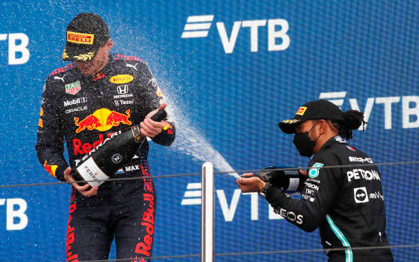 Race winner Lewis Hamilton of Great Britain and Mercedes GP celebrates on the podium with second placed Max Verstappen of Netherlands and Red Bull...