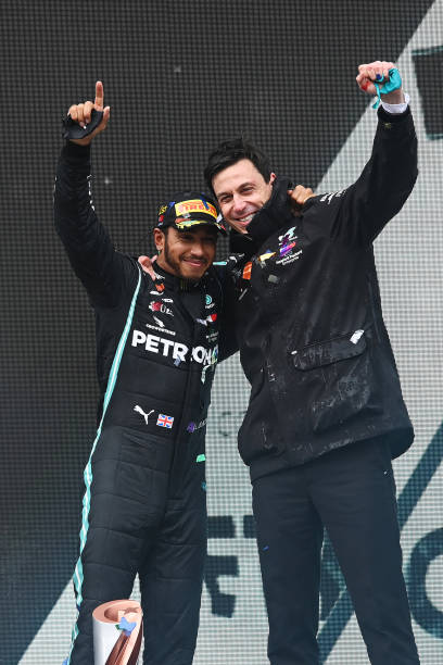 Hamilton and Wolff celebrating Championship wins for Hamilton and Mercedes