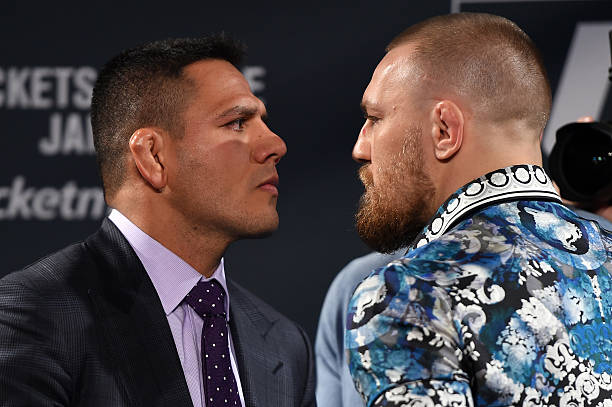 Rafael dos Anjos of Brazil and Conor McGregor of Ireland face off during the UFC 197 on-sale press conference event inside MGM Grand Hotel & Casino...