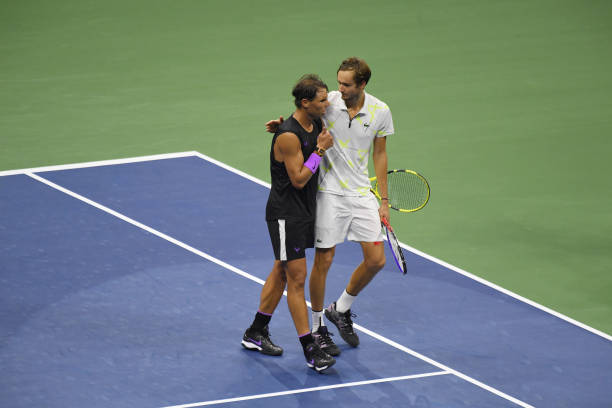 Rafael Nadal of Spain and Daniil Medvedev of Russia have a conversation after their men's singles final match on day fourteen of the 2019 US Open at...