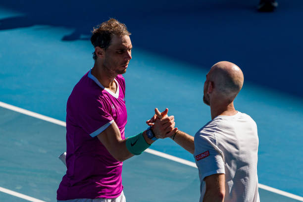 Rafael Nadal of Spain shakes hands with Adrian Mannarino of France after winning match point in his fourth round singles match during day seven of...