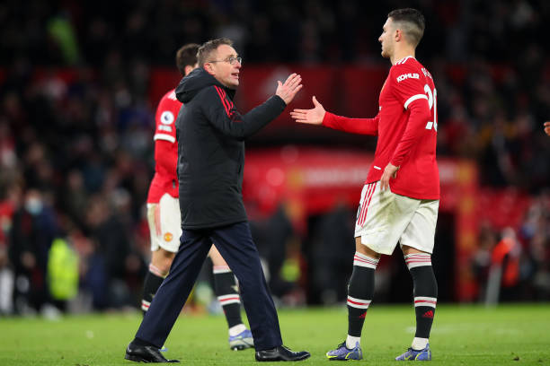 Ralf Rangnick the interim / caretaker manager / head coach of Manchester United and Diogo Dalot of Manchester United at full time during the Premier...