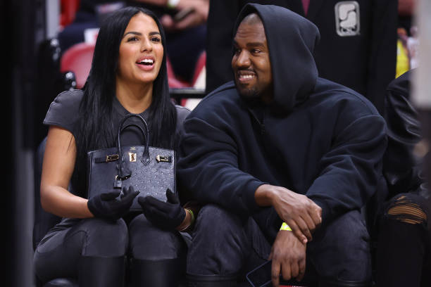 Rapper Kanye West and girlfriend Chaney Jones attend a game between the Miami Heat and the Minnesota Timberwolves at FTX Arena on March 12, 2022 in...